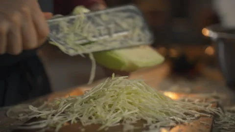 Cabbage shredding process using a special knife for fermentation preparation Stock Footage 331348160