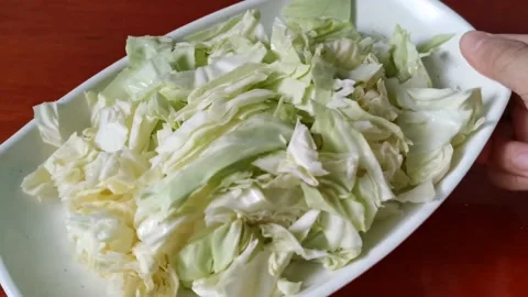 Cabbage Thin Strips on a Plate Stock Footage 158076331