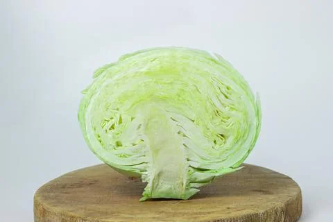 Cabbage on a white background. Cabbage cut in half on a light background Stock Photos