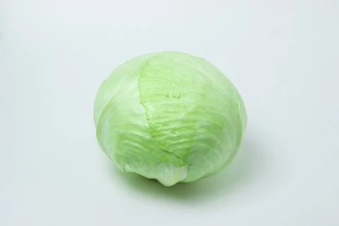 Cabbage on a white background. Head of cabbage on a light background. Stock Photos