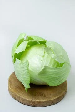 Cabbage on a white background. Head of cabbage on a light background. Stock Photos