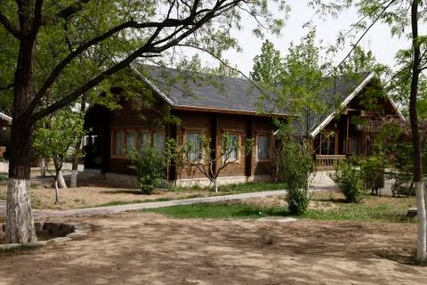 The cabin among the trees Stock Photos