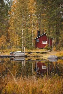 Cabin with boat dock in autumn colours in tiilikkajarvi national park, kainuu Stock Photos