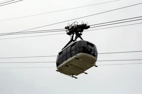 Cabin cableway on a background of cloudy sky. Stock Photos
