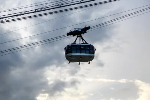 Cabin cableway on a background of cloudy sky. Stock Photos