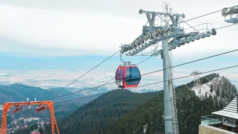 Cabin climbs cable to top of mountain, lift at ski resort. winter fairy tale Video stock 229643054