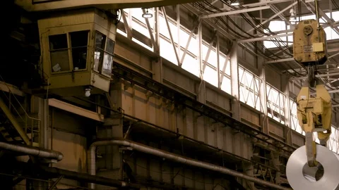 Cabin of Crane in Modern Steel Mill Moving Away from Camera Stock Footage 89944544