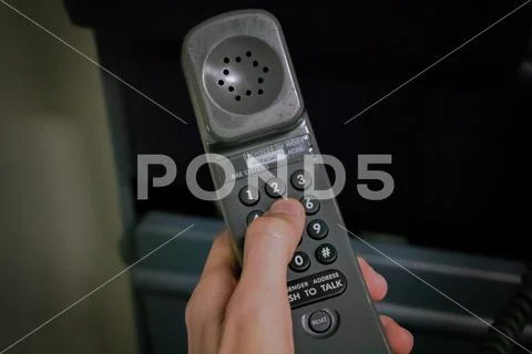 Cabin crew using interphone on first person view Stock Photos