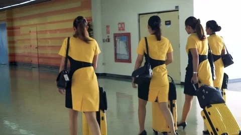 Cabin Crew in Yellow Uniform Proceeding Through Airport, Thailand - 22 August Stock Footage 79967402