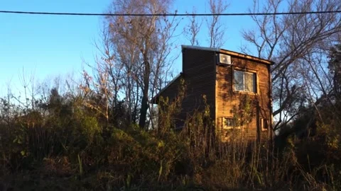 Cabin in the forest at sunset Stock Footage 196447481