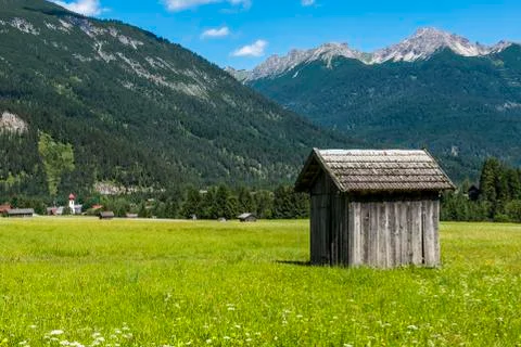 Cabin in Meadow Stanzach Stock Photos
