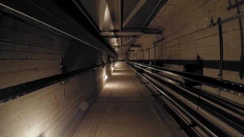 The cabin moves down in an elevator shaft. Stock-Footage 88429265