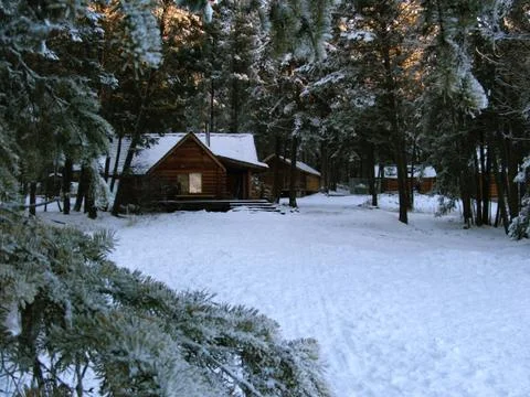 Cabin in the snow Stock Photos