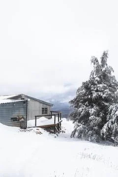 Cabin in the snow Stock Photos