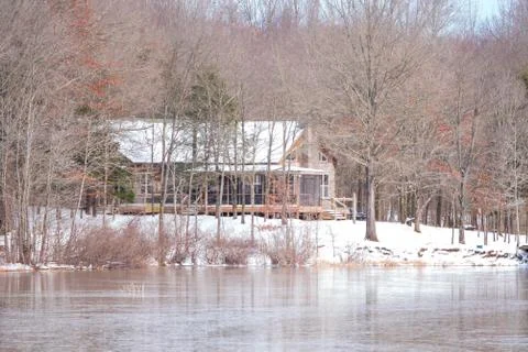 Cabin in a snow scene Stock Photos