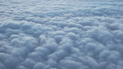 Cabin view: layers upon layers of fluffy clouds. Stock Footage 335736807