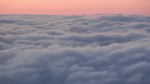 Cabin window view: layers of clouds at sunset. Stock Footage 330539675