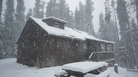 Cabin in winter with falling snow Stock Footage 83634097