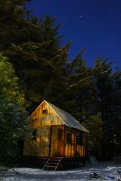 A cabin the in the woods Stock Photos