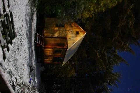 A cabin the in the woods Stock Photos
