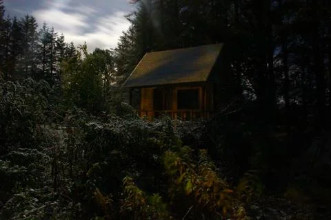A cabin the in the woods Stock Photos