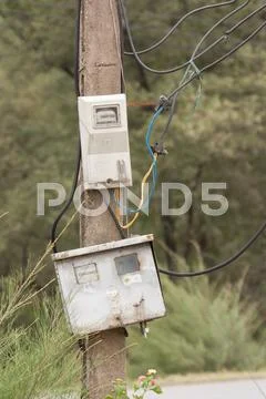 Cabinet With Electrical Meter On A Concrete Pole