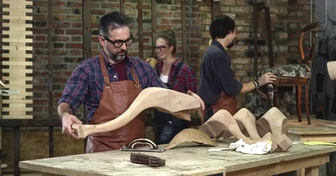 Cabinet Maker is Happy with his Work Stock Footage 74489623