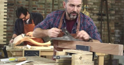 Cabinet Maker Planes the Beech Wood, Preparing it for Future Work Stock Footage 74489484