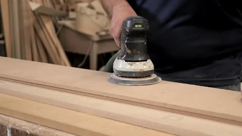 Cabinet maker sanding down wood Stock Footage 76413692