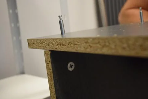 Cabinet Panel with Cam Lock Fasteners and Cam Pin Installation 库存照片