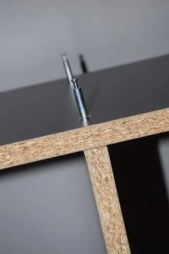 Cabinet Panel with Cam Lock Fasteners and Cam Pin Installation 库存照片