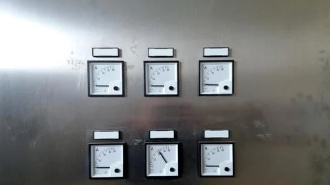Cabinet Panel Displaying Multiple Ammeters for Electrical Current Measurement Stock Photos
