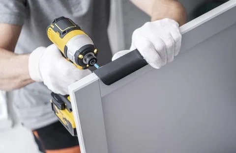 Cabinetmaker with a Drill Driver in His Hand Photos