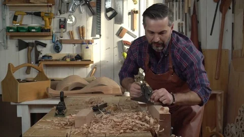 Cabinetmaker Planes Solid Wood in his Workshop Stock Footage 75144942