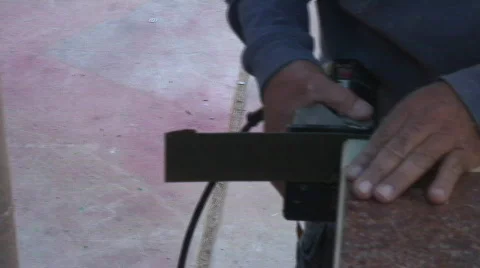 Cabinetry shop - 14 - hand routing edge of couter top and finish cut Stock Footage