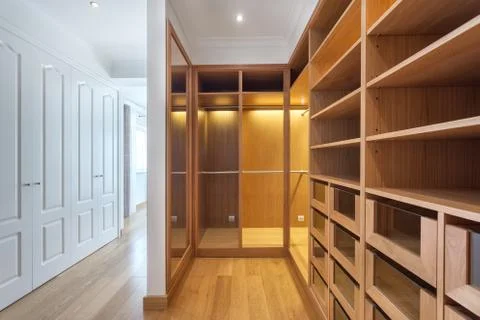 Cabinets and an empty dressing room made of wood, for family. Stock Photos