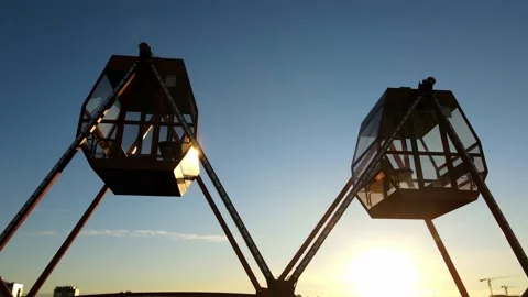 Cabins of a carousel in the backlight of the rising sun. Parts of the Stock Footage 165436567