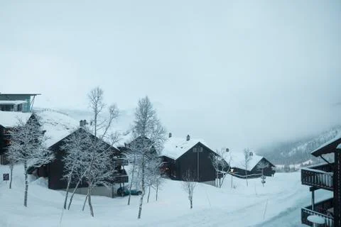 Cabins on cold winter mountain Stock Photos