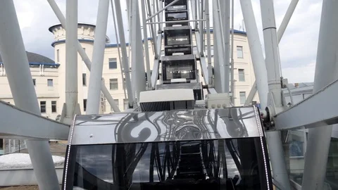 Cabins Ferris Wheel rotating on a cloudy sky background. Stock Footage 88922472