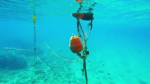 Cable from the anchor and the boat under water Stock Footage