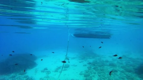 Cable from the anchor and the boat under water Stock Footage