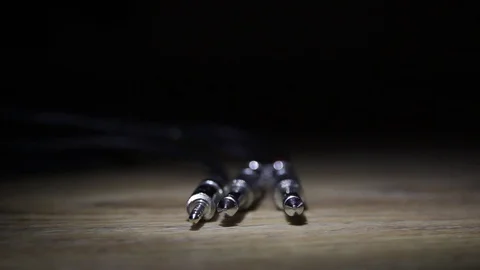 Cable for audio equipment closeup on dark background Stock Footage 73700868