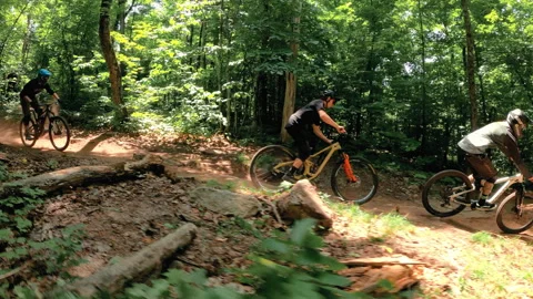 Cable cam downhill mountain biking through forest trails Stock Footage 171814546