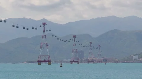 Cable car across the sea with a view of the mountains Stock Footage 286030979