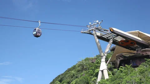 Cable car approaching a station on top of mountain Stock Footage 35796784