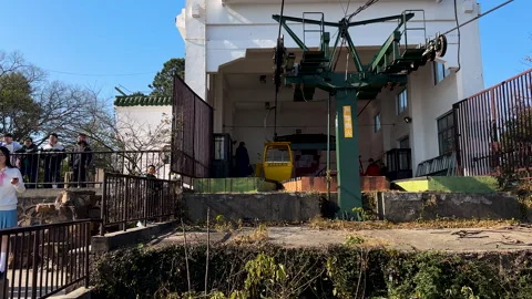 Cable car approaching terminal on the summit of Huishan or Mount Hui Stock Footage 296636049