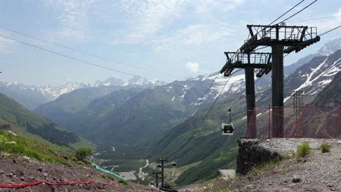 Cable car ascending Mount Elbrus with Caucasus mountain valley views Stock Footage 341863174