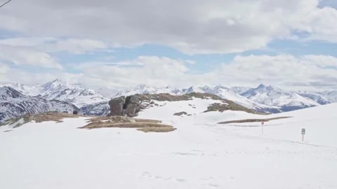 Cable car ascending over snowy mountain landscape 스톡 동영상 310164001