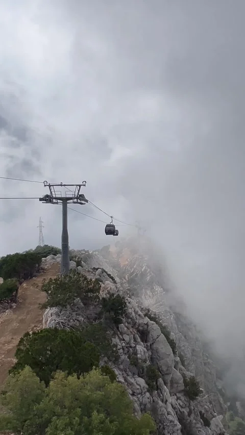 Cable car between clouds over the mountains Stock Footage 337130001