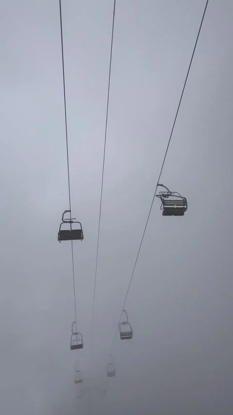 Cable car between clouds over the mountains Stock Footage 337130144